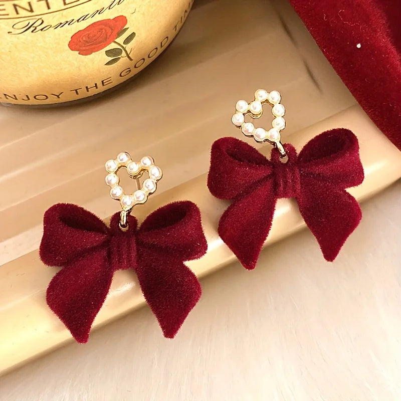 plush bow pearl earrings